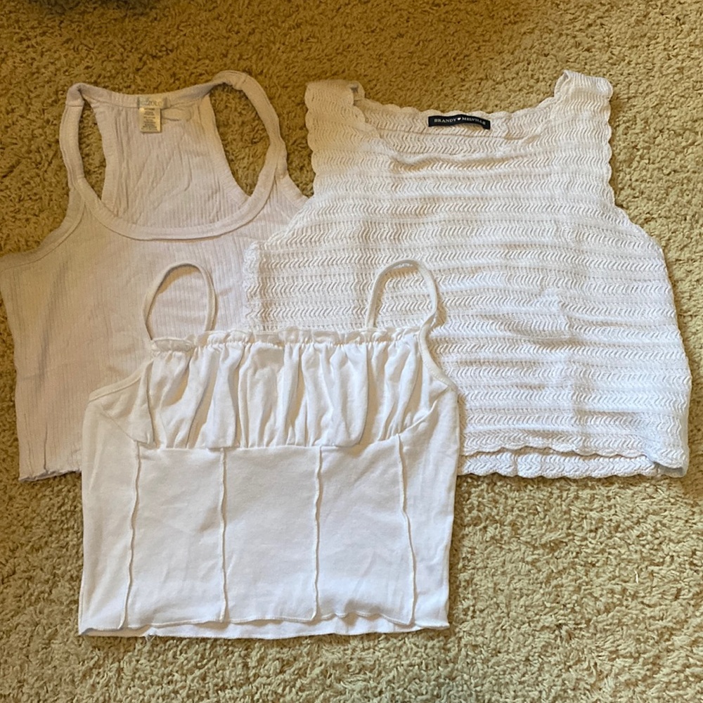 Lot of white tank tops